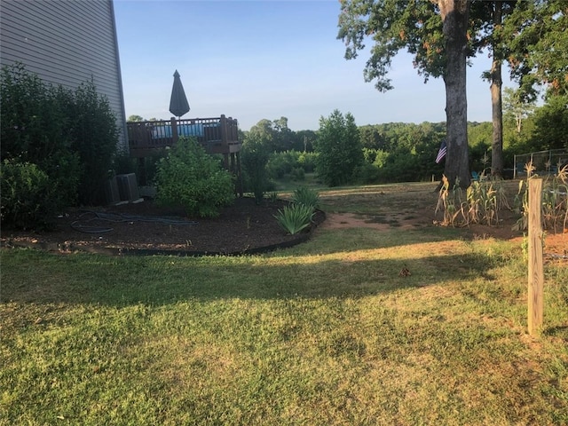 view of yard with a wooden deck