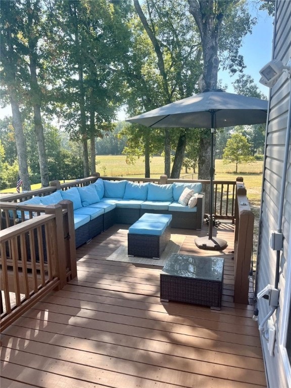 wooden terrace featuring an outdoor living space