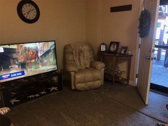 living area with baseboards and carpet flooring