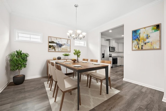 dining area with ornamental molding, dark hardwood / wood-style floors, and a notable chandelier