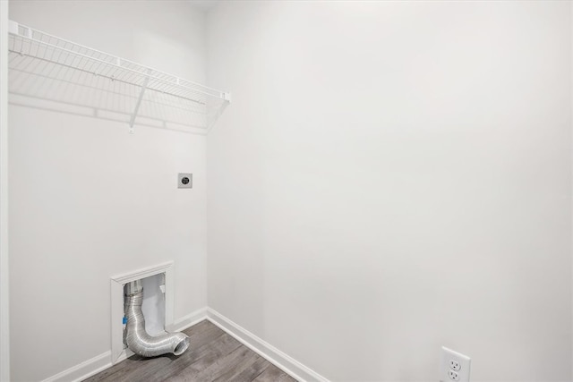 washroom with hardwood / wood-style floors and hookup for an electric dryer