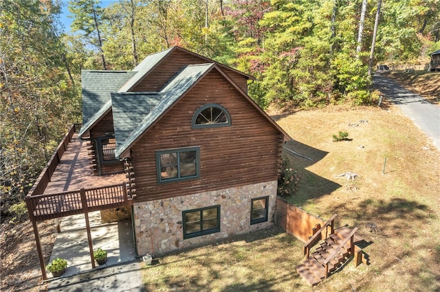 view of side of property with a deck