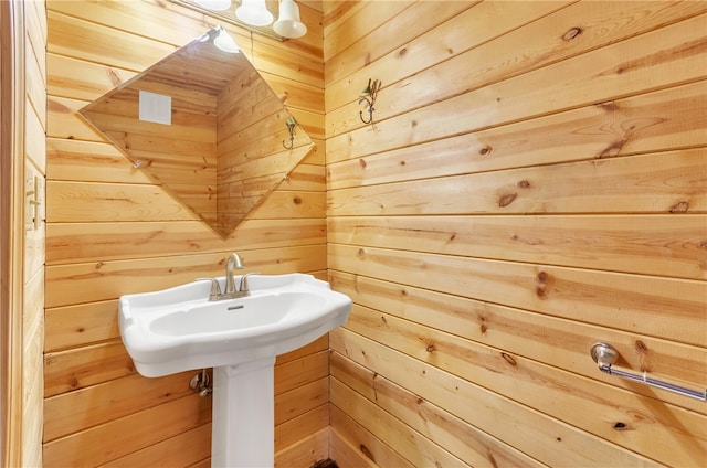 bathroom with wood walls