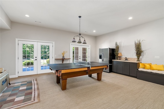 playroom featuring sink, light carpet, and french doors