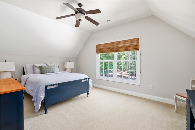 bedroom featuring vaulted ceiling, ceiling fan, and light colored carpet