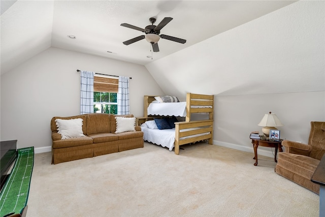 bedroom with vaulted ceiling, light carpet, and ceiling fan