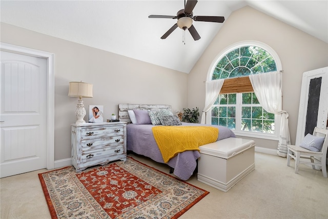 bedroom with lofted ceiling, light carpet, and ceiling fan