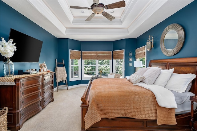 bedroom featuring ceiling fan, light colored carpet, a raised ceiling, and crown molding