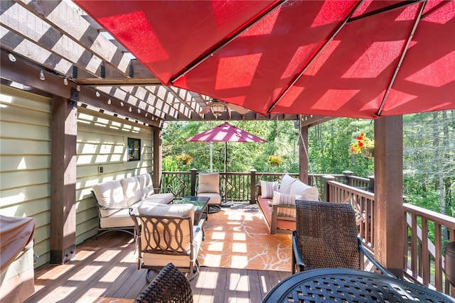 wooden terrace with a pergola and an outdoor living space