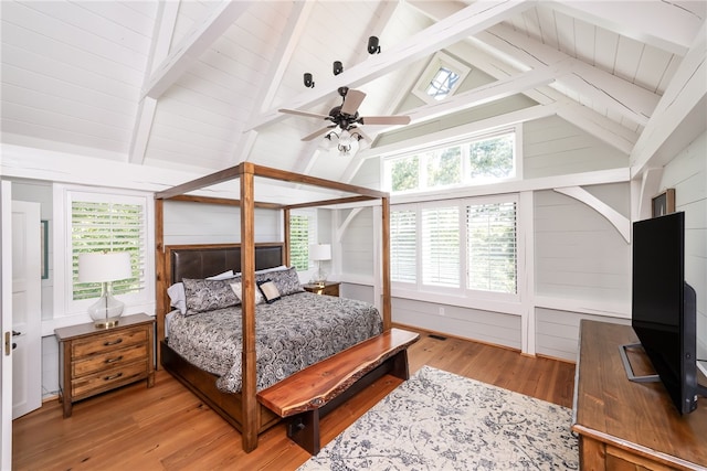 bedroom featuring multiple windows, light wood-type flooring, and ceiling fan