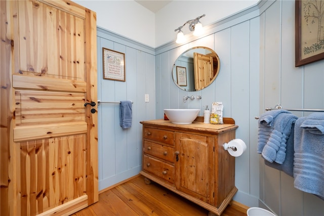 bathroom with wood-type flooring and vanity