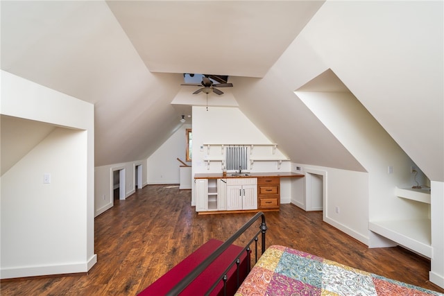 bonus room featuring vaulted ceiling, dark hardwood / wood-style floors, ceiling fan, and sink