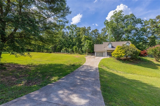 view of front facade featuring a front yard and a garage