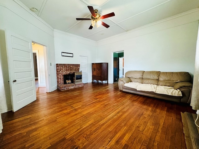 unfurnished living room with ceiling fan, hardwood / wood-style flooring, and a brick fireplace