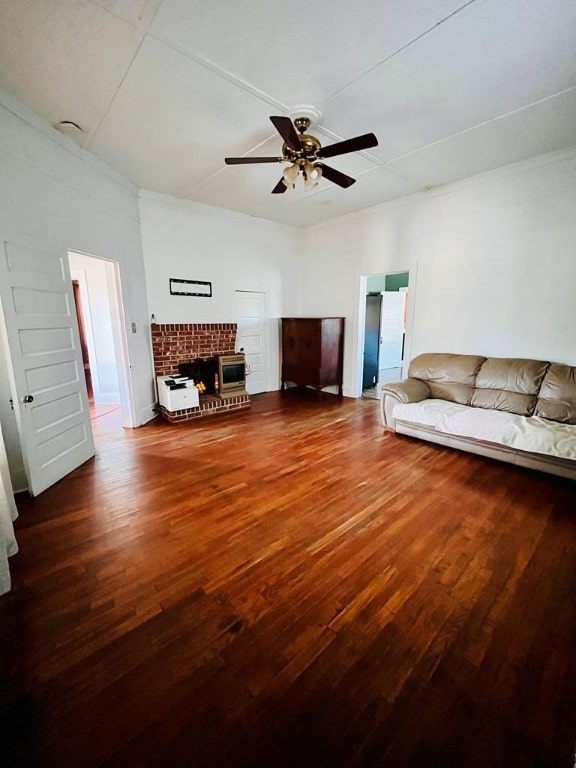 living room featuring dark hardwood / wood-style flooring and ceiling fan