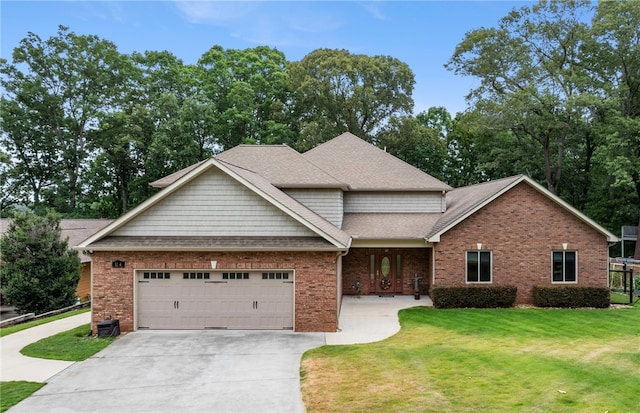 view of front facade with a front yard and a garage