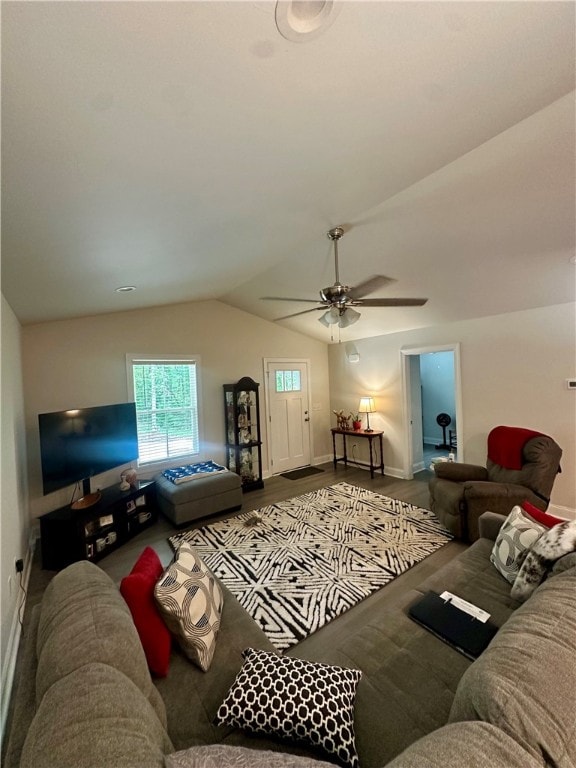 living room with wood-type flooring, lofted ceiling, and ceiling fan