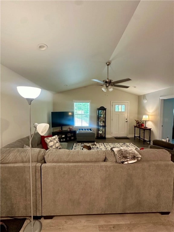 living room featuring lofted ceiling, ceiling fan, and hardwood / wood-style floors