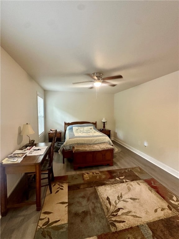 bedroom featuring ceiling fan and hardwood / wood-style floors