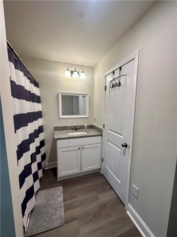 bathroom featuring hardwood / wood-style floors and vanity