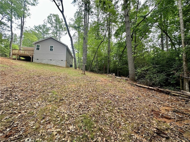 view of yard featuring a wooden deck