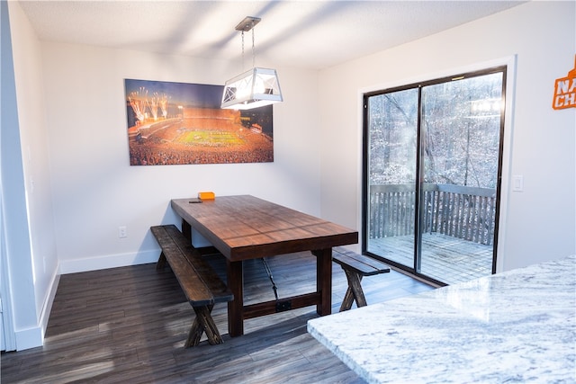 dining room with dark hardwood / wood-style floors