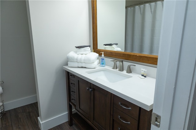 bathroom featuring hardwood / wood-style flooring and vanity