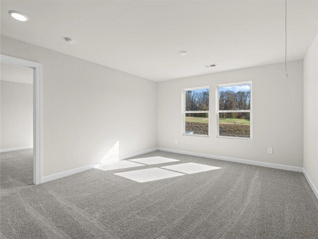 unfurnished room featuring carpet