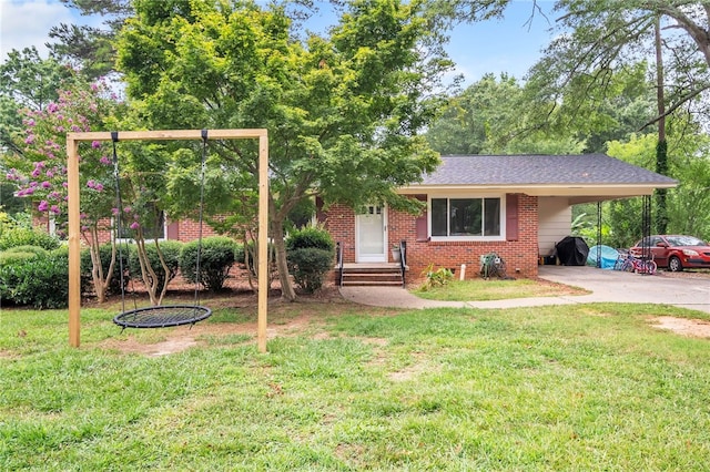 405 Forest Ln, Belton, SC 29627 - view of front of house with a carport, brick siding, a front lawn, and driveway