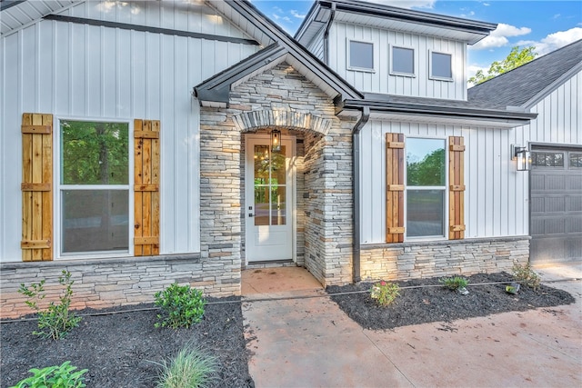 doorway to property featuring a garage