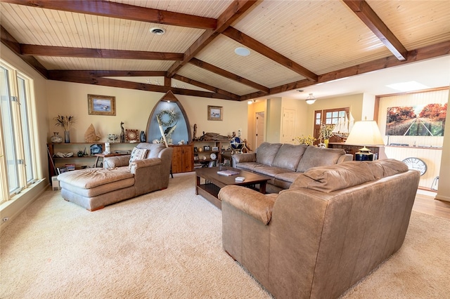 living room featuring wood ceiling, vaulted ceiling with beams, and light colored carpet