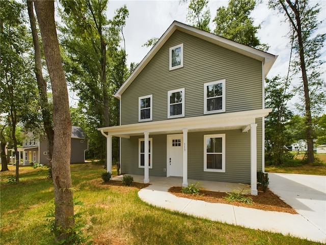 view of front of home with a front lawn and a porch