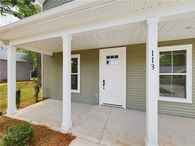 property entrance with covered porch