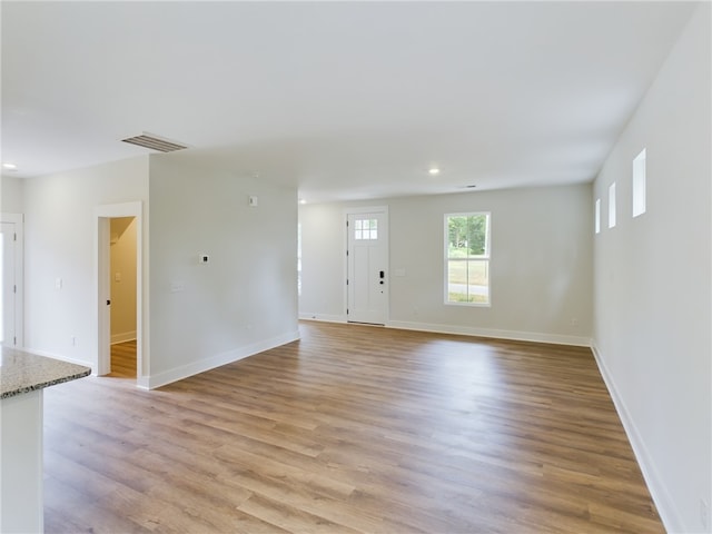 113 Norbert Ln, Anderson, SC 29624 - unfurnished living room with baseboards, visible vents, light wood-style flooring, and recessed lighting