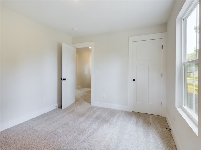 113 Norbert Ln, Anderson, SC 29624 - unfurnished bedroom featuring light colored carpet, a closet, and baseboards