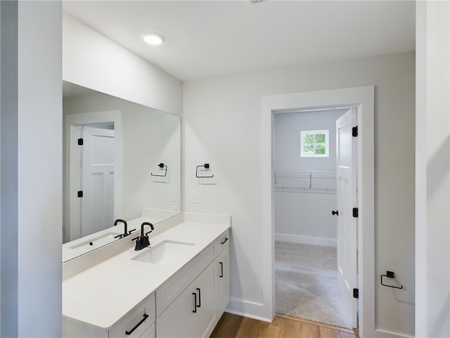 bathroom featuring vanity and hardwood / wood-style flooring