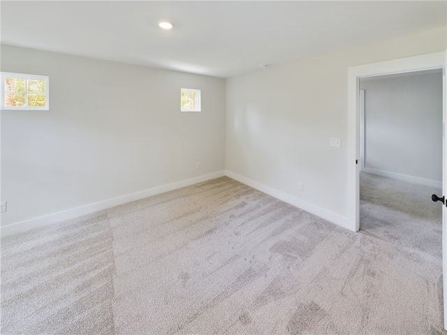 carpeted empty room with a wealth of natural light