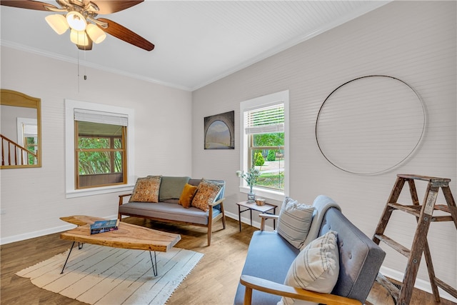 living room featuring ornamental molding, ceiling fan, and hardwood / wood-style flooring