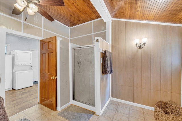 bathroom featuring walk in shower, beamed ceiling, wood ceiling, and stacked washer / drying machine