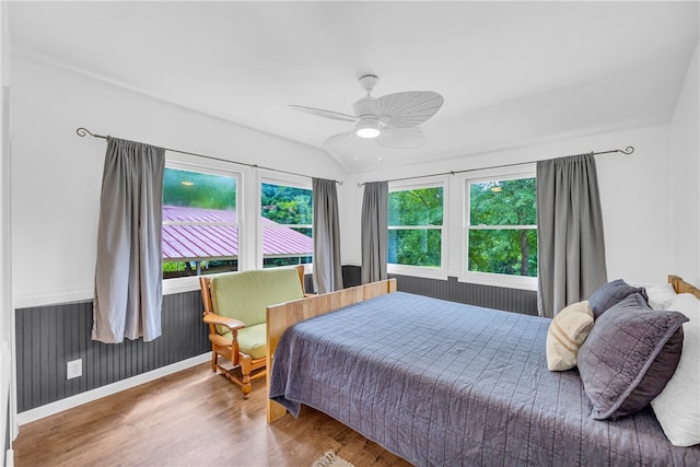 bedroom featuring lofted ceiling, ceiling fan, and hardwood / wood-style floors