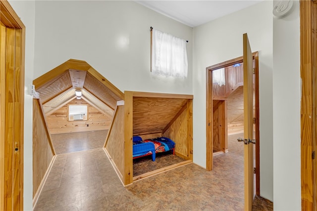 unfurnished bedroom with wooden walls