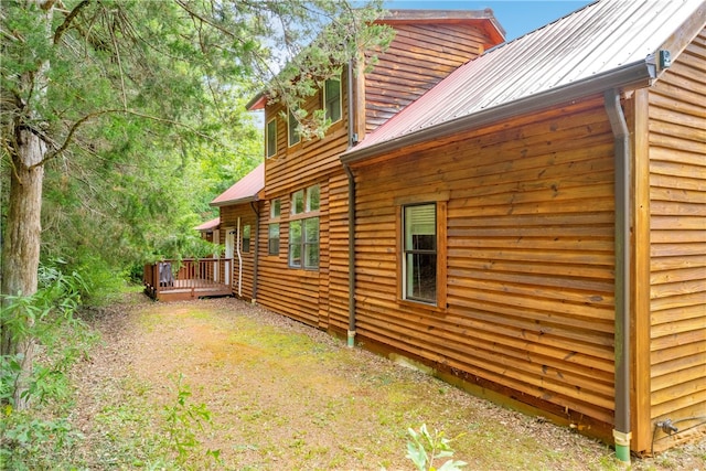 view of side of property featuring a deck