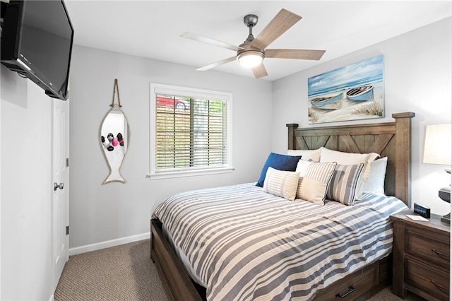 bedroom featuring ceiling fan and carpet