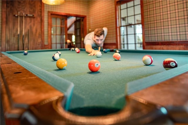 recreation room with billiards and carpet flooring