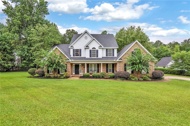 view of front of home featuring a front lawn and a porch