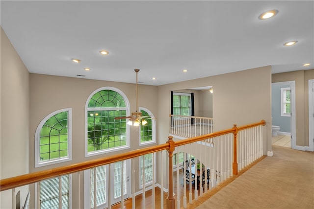 hallway featuring plenty of natural light