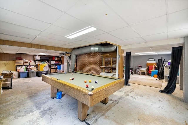 game room with a drop ceiling, concrete floors, and billiards