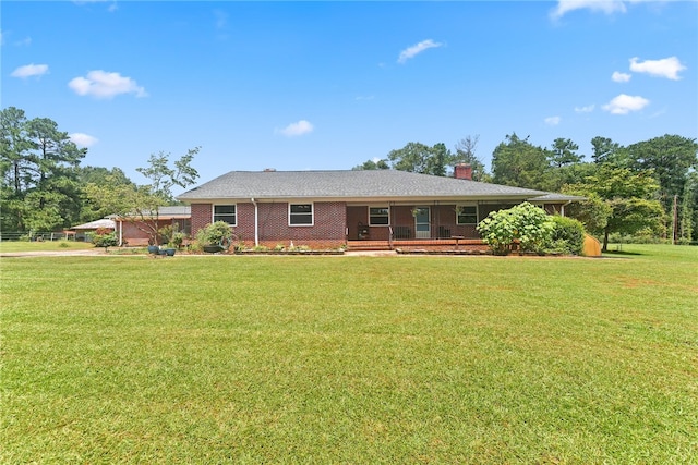 ranch-style house with a front lawn