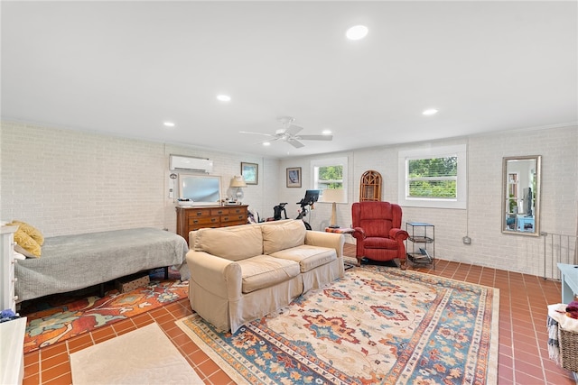 tiled living room with an AC wall unit, ceiling fan, and brick wall