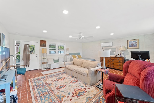 living room with an AC wall unit, ceiling fan, and tile patterned floors